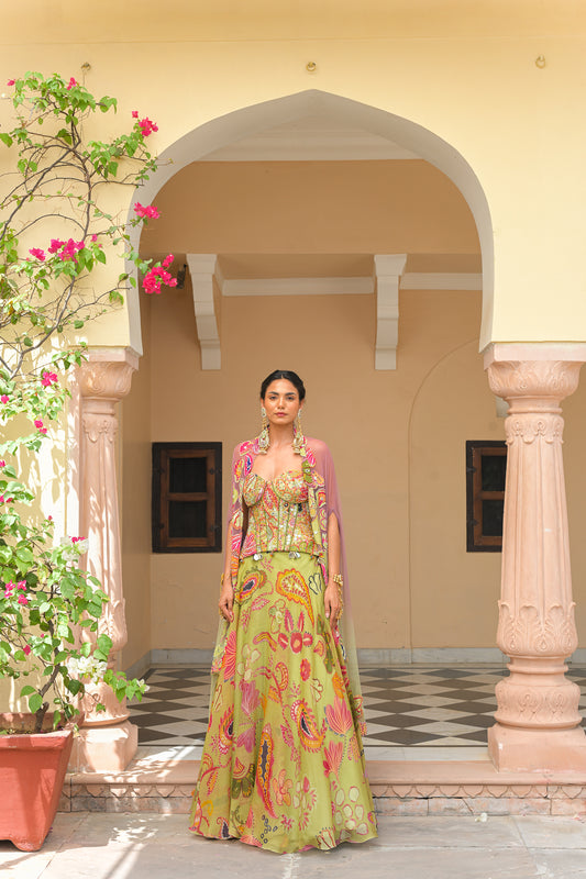 OLIVE BLOOM PRINTED LEHENGA AND EMBROIDERED. MIRROR CORSET AND APPLIQUÉ DUAL CAPE HIGHLIGHT