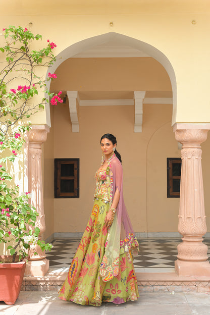 OLIVE BLOOM PRINTED LEHENGA AND EMBROIDERED. MIRROR CORSET AND APPLIQUÉ DUAL CAPE HIGHLIGHT
