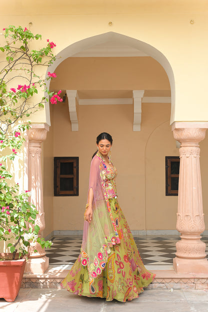 OLIVE BLOOM PRINTED LEHENGA AND EMBROIDERED. MIRROR CORSET AND APPLIQUÉ DUAL CAPE HIGHLIGHT