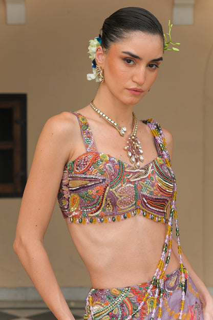 VOILET BLOOM FISH TAIL SKIRT WITH ATTACHED TASSEL. PALLA AND VIOLET BLOOM EMBROIDERED CORSET BLOUSE
