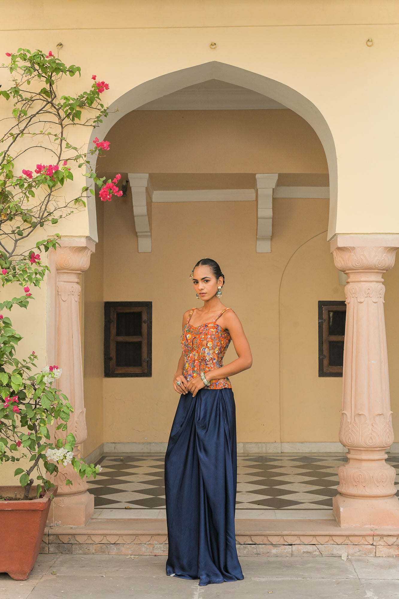 AMBER BLOOM HIGHLIGHT CORSET PAIRED WITH. NAVY BLUE COWL SKIRT SET
