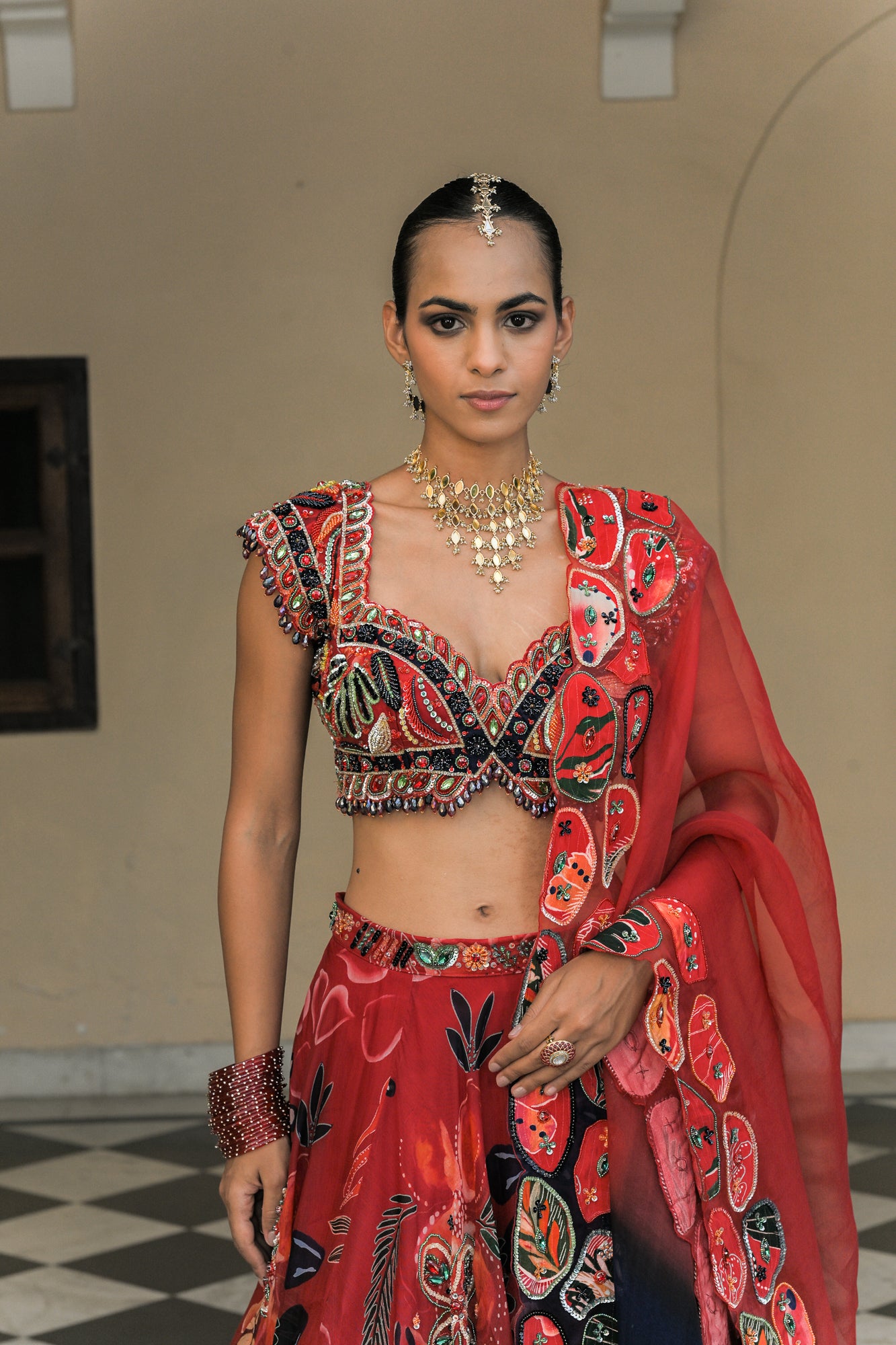 SCARLET BLOOM HIGHLIGHT LEHENGAS WITH HIGHLIGHT. EMBROIDERED BLOUSE AND DUAL APPLIQUE PATCH. HIGHLIGHT DUPATTA