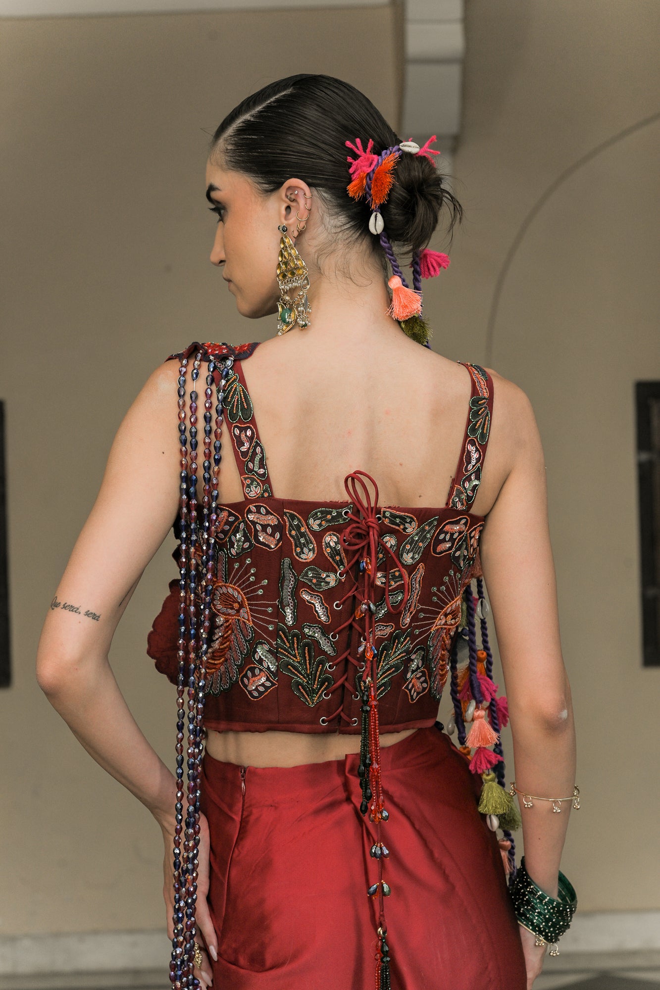 SCARLETTE DHOTI FLOWER PATCH TASSEL SAREE PAIRED. WITH THREAD WORK HIGHLIGHT CORSET BLOUSE