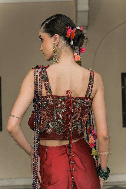SCARLETTE DHOTI FLOWER PATCH TASSEL SAREE PAIRED. WITH THREAD WORK HIGHLIGHT CORSET BLOUSE