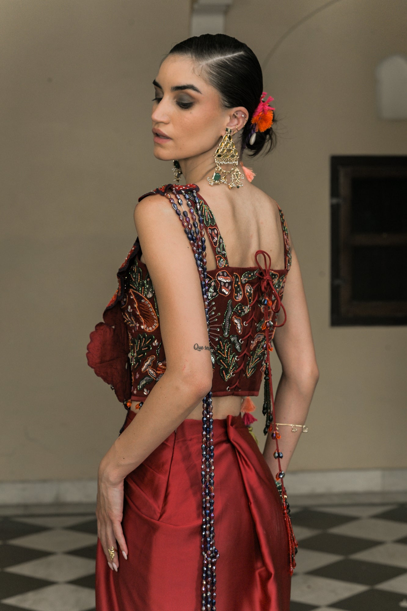 SCARLETTE DHOTI FLOWER PATCH TASSEL SAREE PAIRED. WITH THREAD WORK HIGHLIGHT CORSET BLOUSE