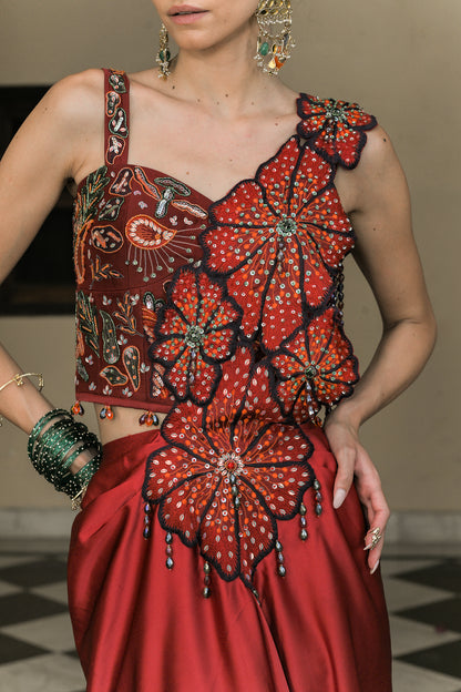 SCARLETTE DHOTI FLOWER PATCH TASSEL SAREE PAIRED. WITH THREAD WORK HIGHLIGHT CORSET BLOUSE