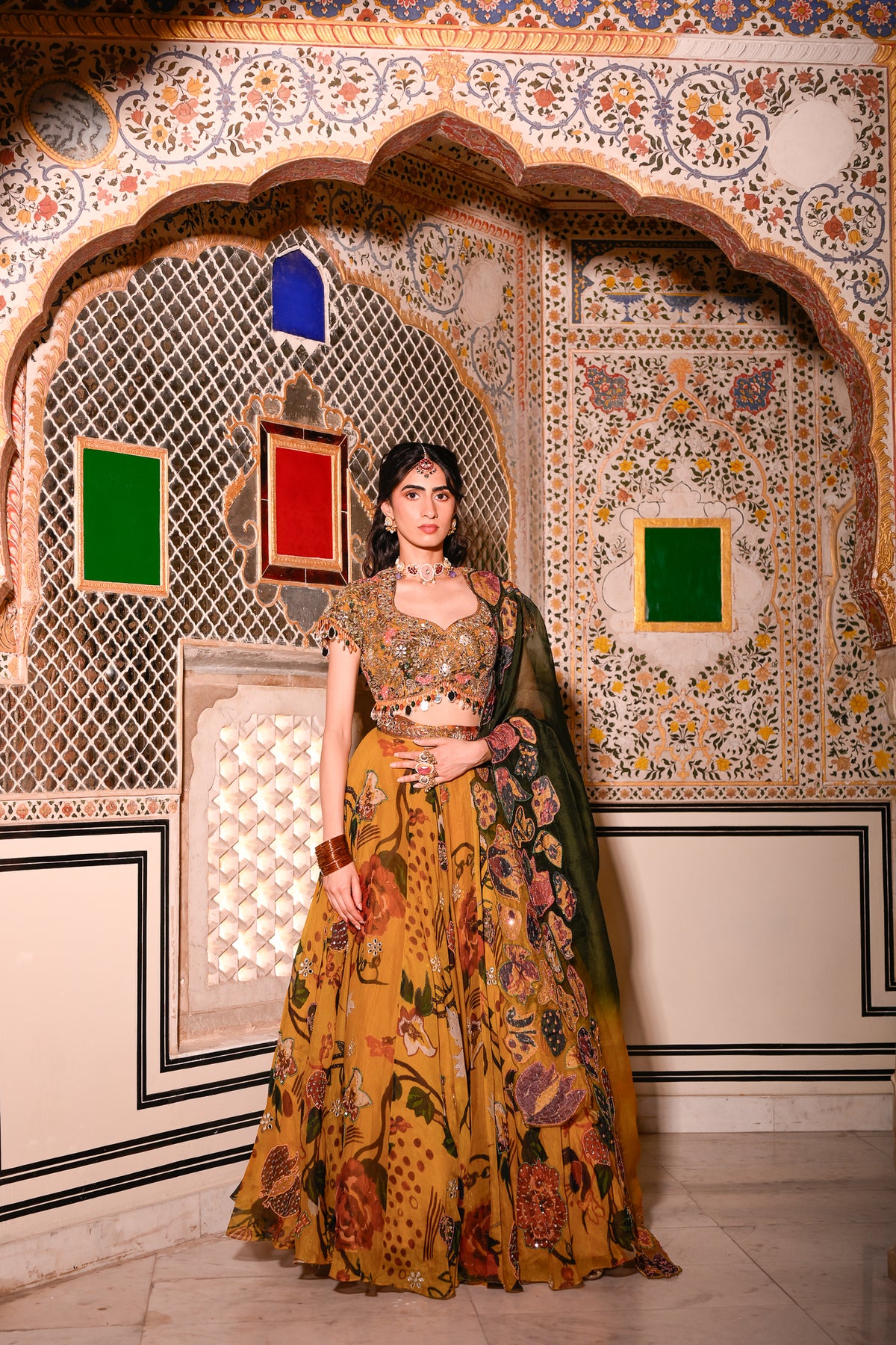 EMB BLOUSE PAIRED WITH HIGHLIGHTED LEHENGA WITH APPLIQUE DUEL CAPE