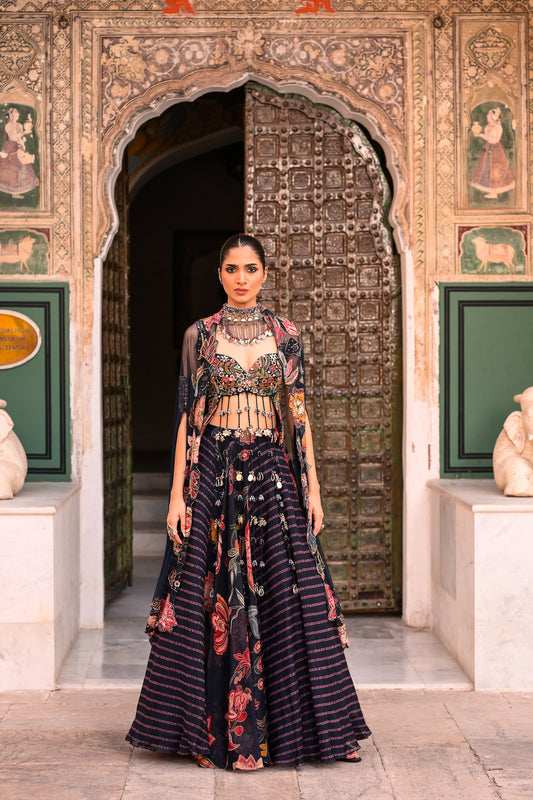 DUEL PRINTED LEHANGA WITH EMB TASSLE BLOUSE WITH APLIQUE CAPE