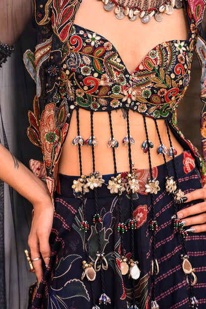 DUEL PRINTED LEHANGA WITH EMB TASSLE BLOUSE WITH APLIQUE CAPE