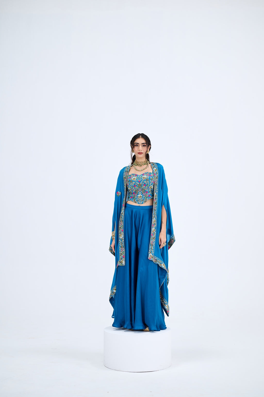 BLUE FLARED PANTS PAIRED WITH EMBROIDEREED CORSET WITH CAPE SET