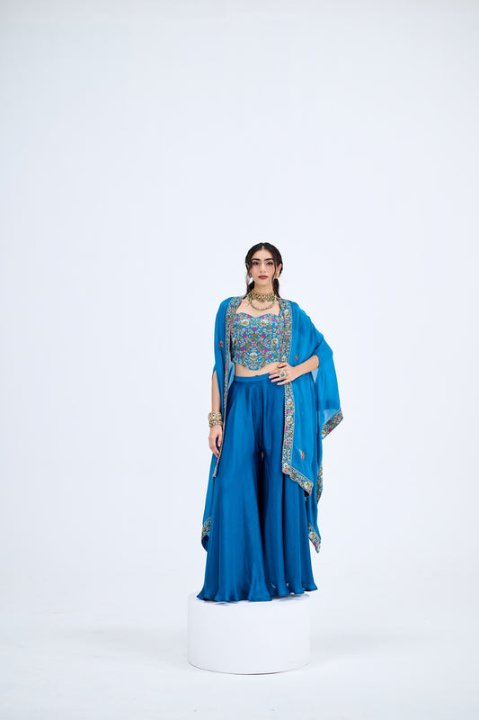 BLUE FLARED PANTS PAIRED WITH EMBROIDEREED CORSET WITH CAPE SET