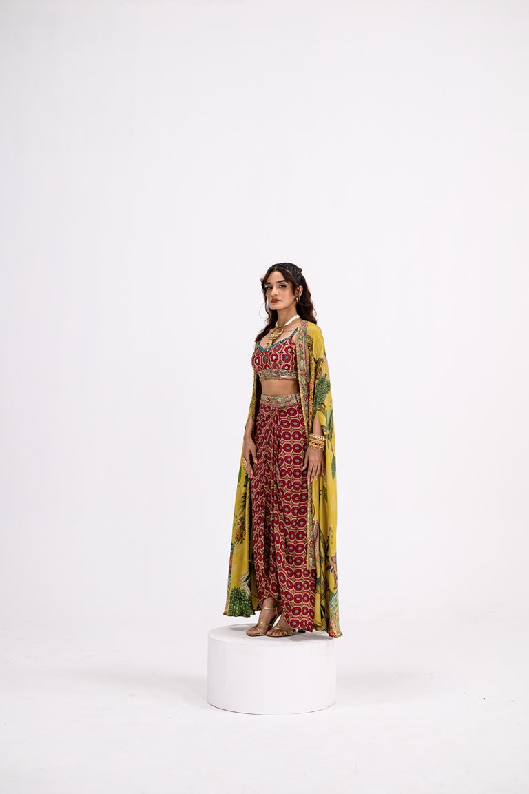 Red Honeycomb Bralette And Skirt Paired With Mustard Mughal Garden Cape