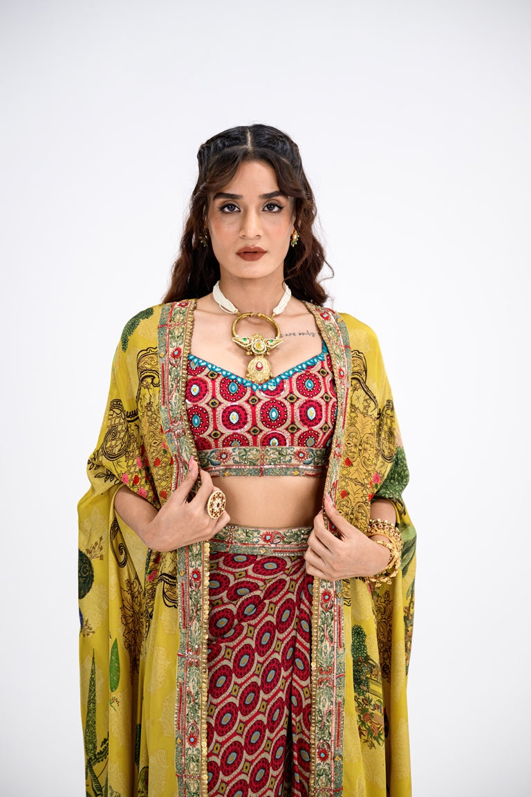 Red Honeycomb Bralette And Skirt Paired With Mustard Mughal Garden Cape