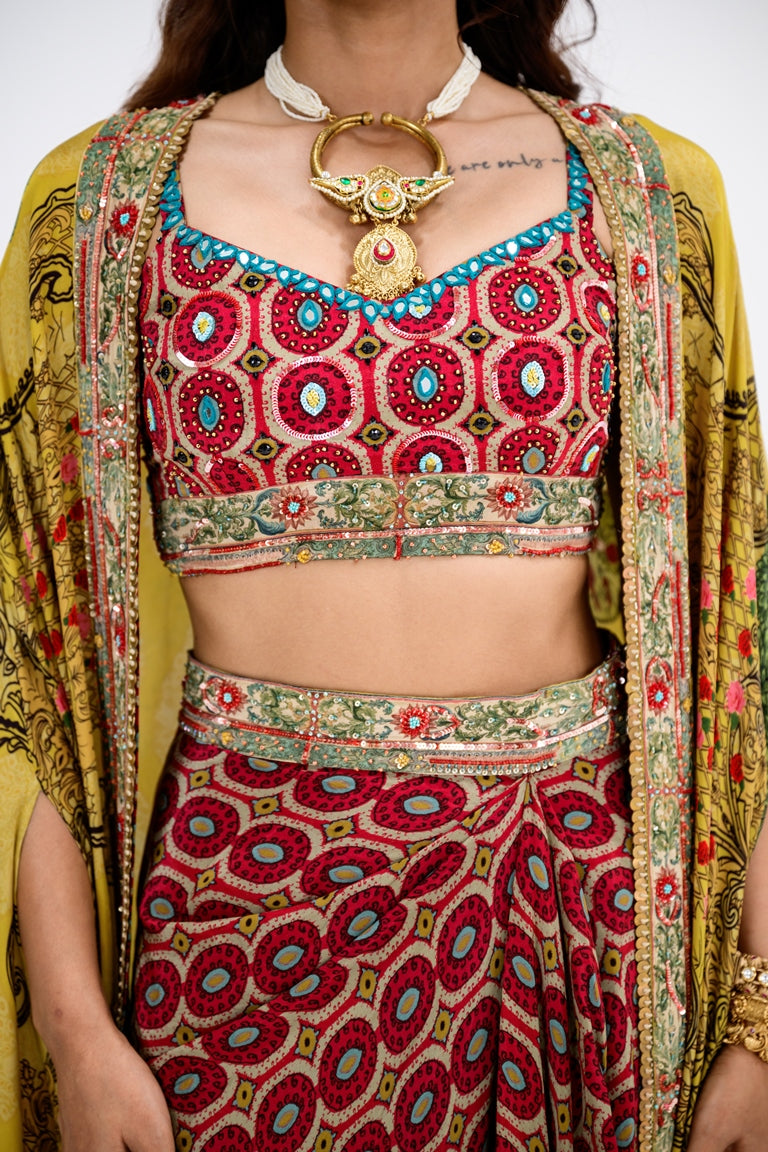 Red Honeycomb Bralette And Skirt Paired With Mustard Mughal Garden Cape