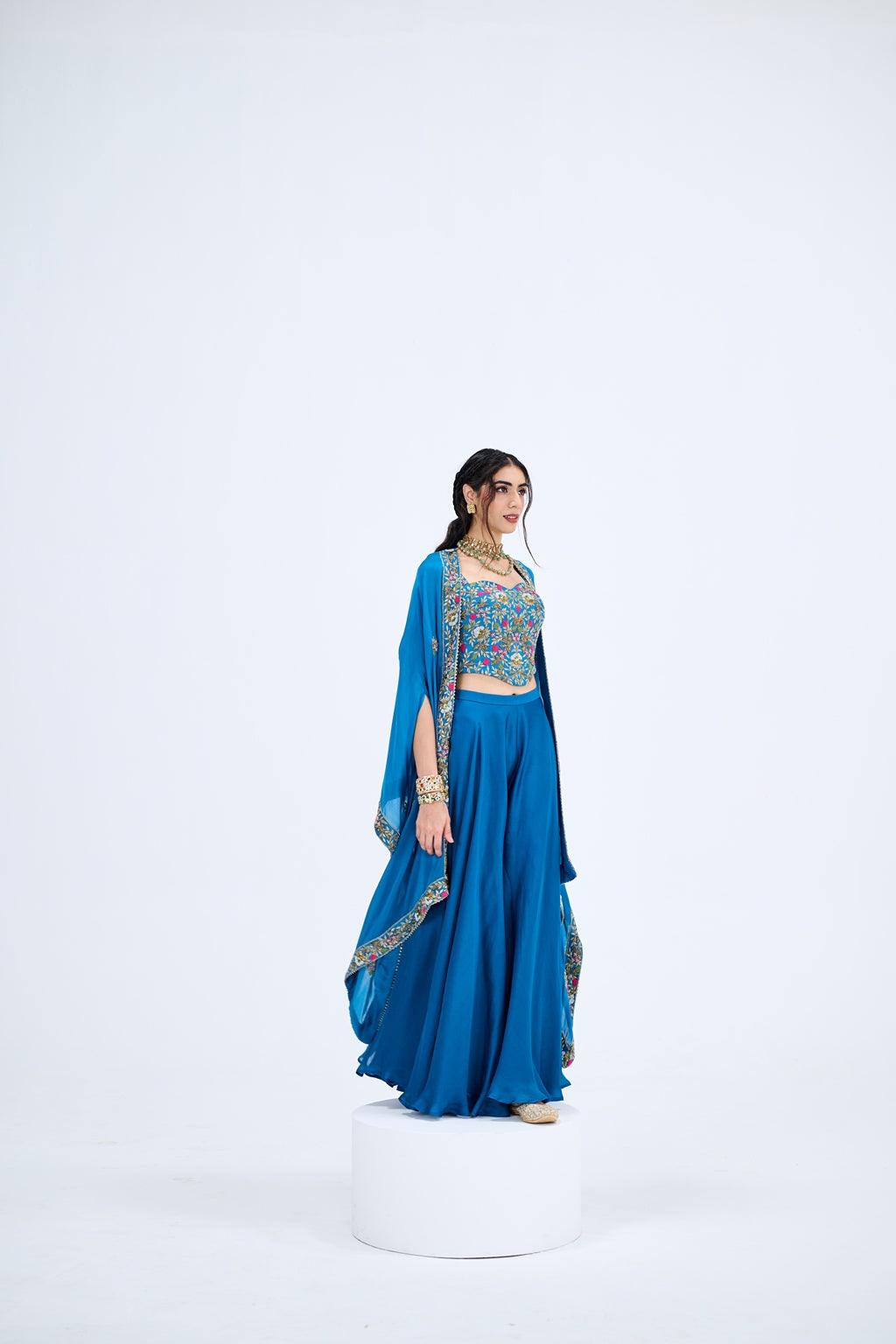 BLUE FLARED PANTS PAIRED WITH EMBROIDEREED CORSET WITH CAPE SET