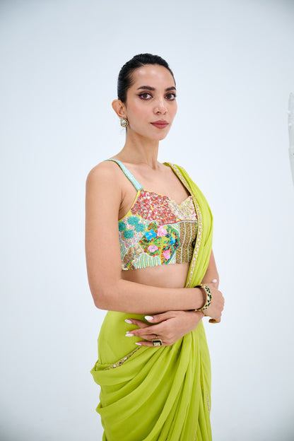 LIGHT GREEN PRE DRAPED SAREE PAIRED WITH EMBROIDERED CORSET AND EMEBELISHED BELT