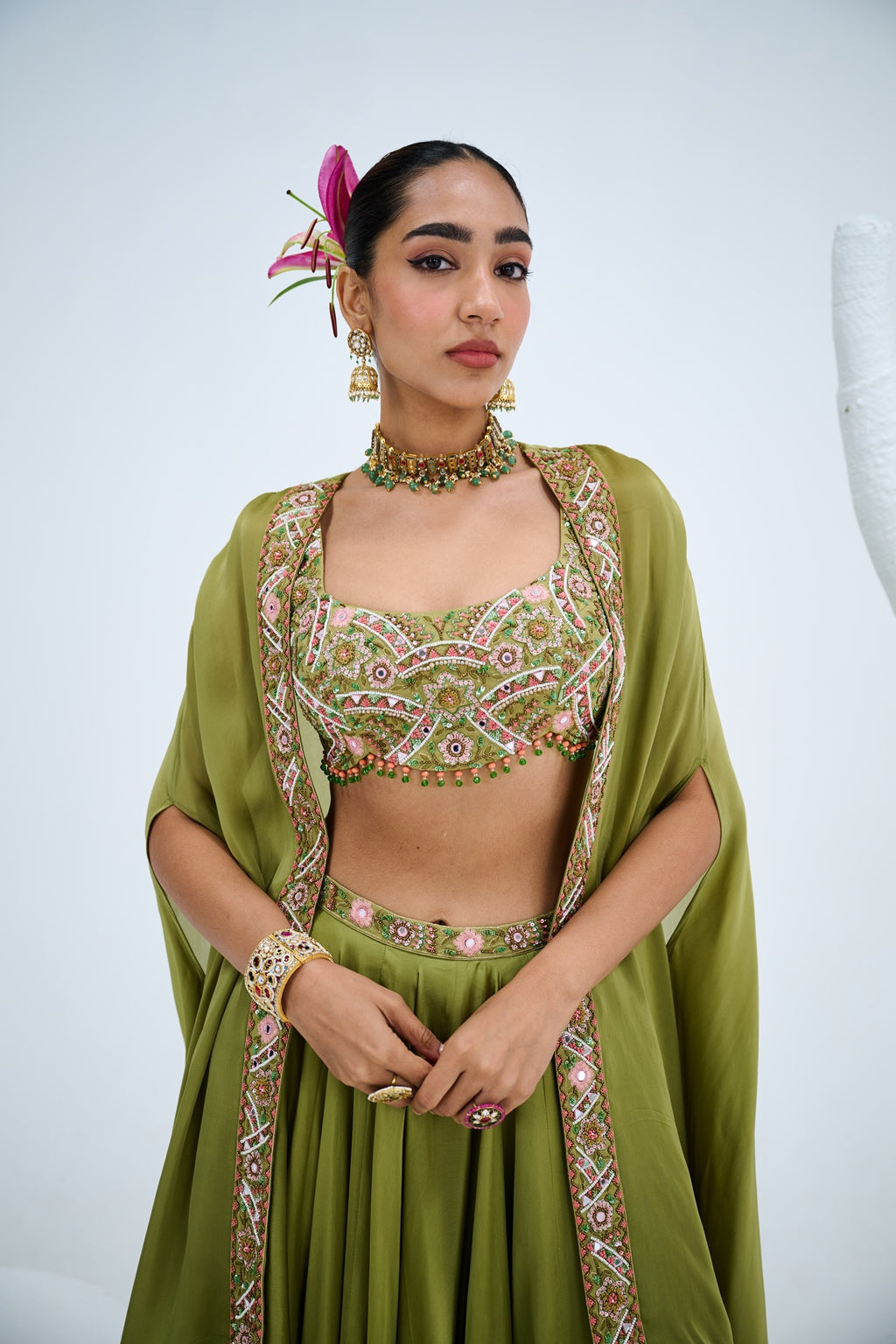 OLIVE GREEN LEHENGA PAIRED WITH EMBROIDERED BUSTIER AND CAPE SET