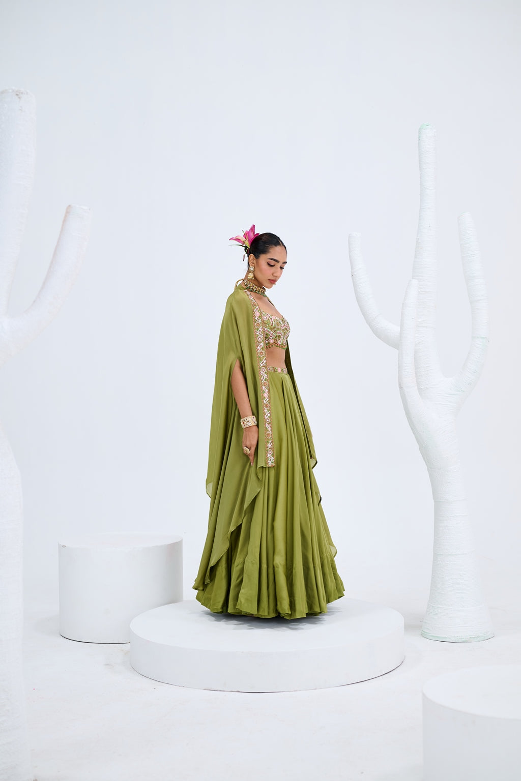 OLIVE GREEN LEHENGA PAIRED WITH EMBROIDERED BUSTIER AND CAPE SET