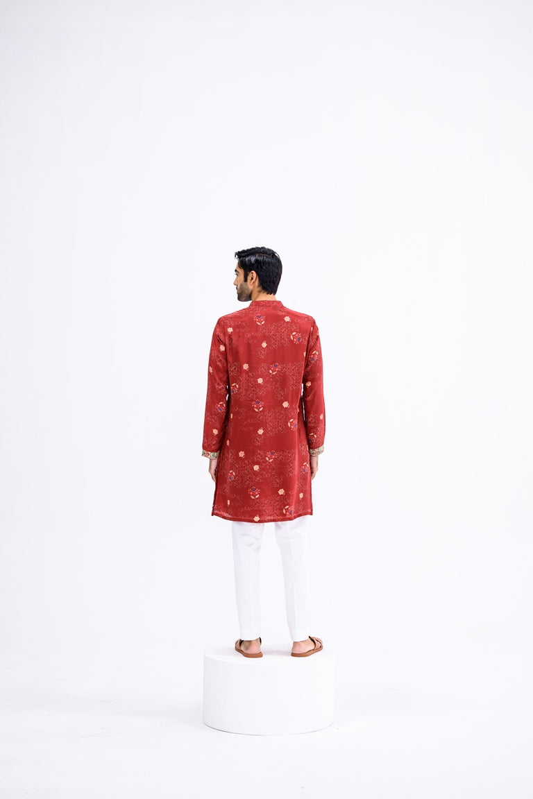 Red Overall Kurta Paired With White Pants And Highlight Sleeve Border