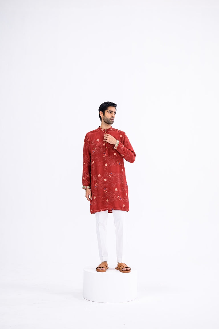 Red Overall Kurta Paired With White Pants And Highlight Sleeve Border