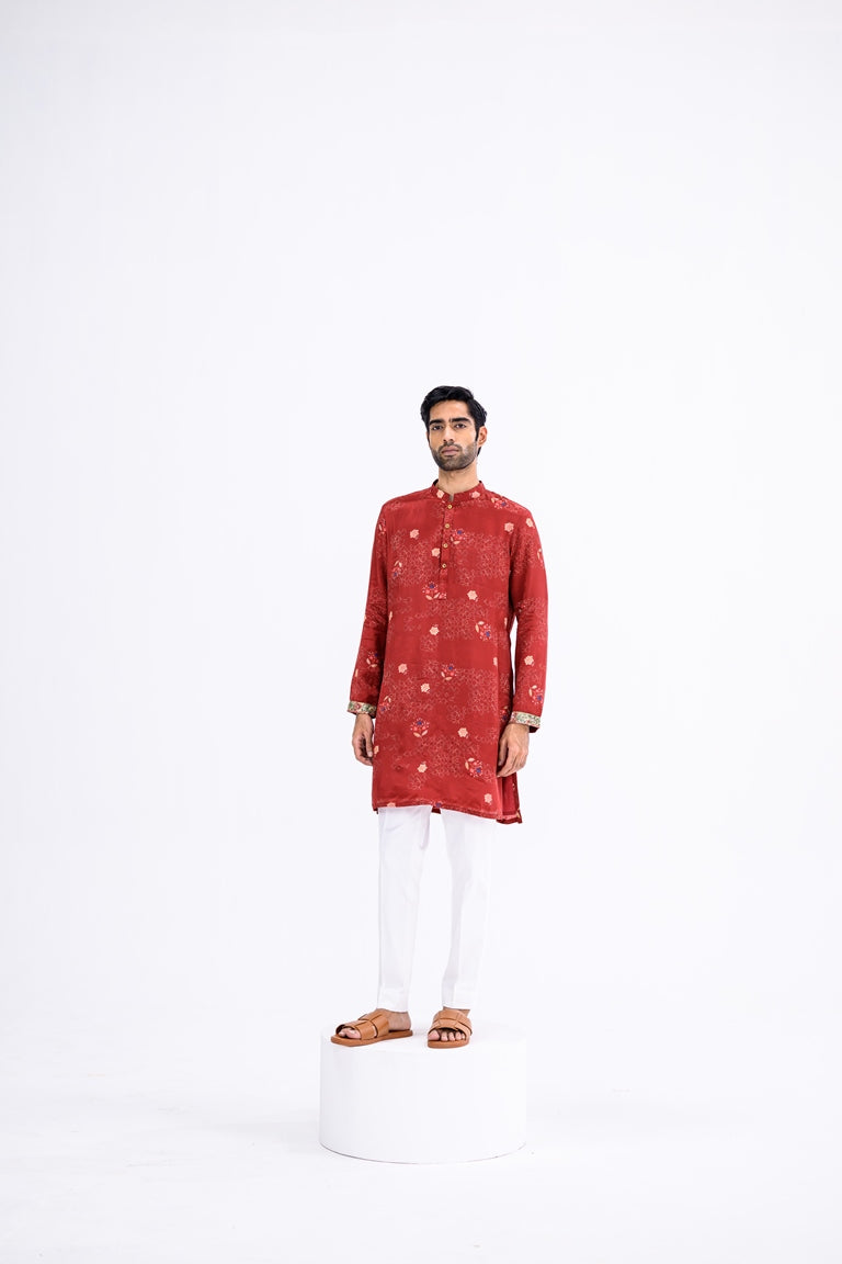 Red Overall Kurta Paired With White Pants And Highlight Sleeve Border