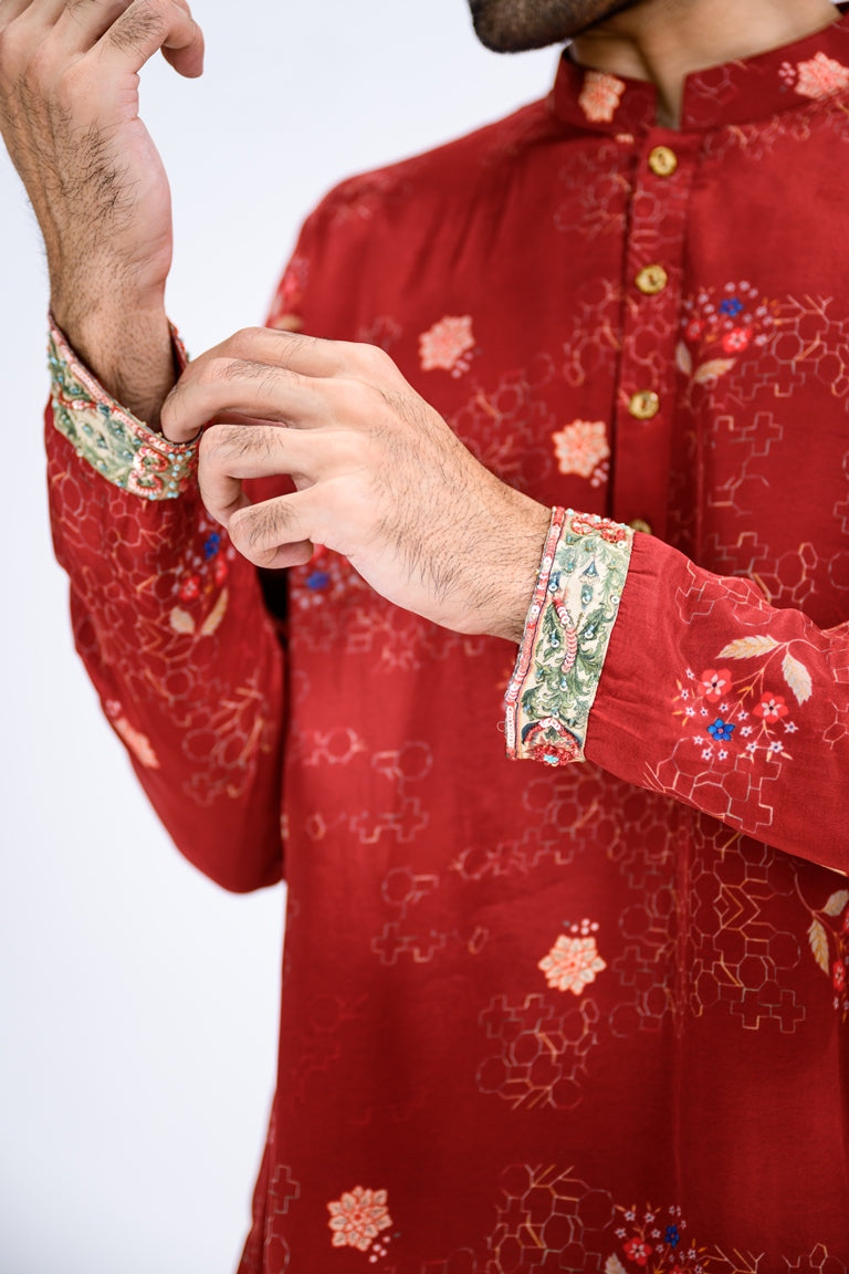 Red Overall Kurta Paired With White Pants And Highlight Sleeve Border