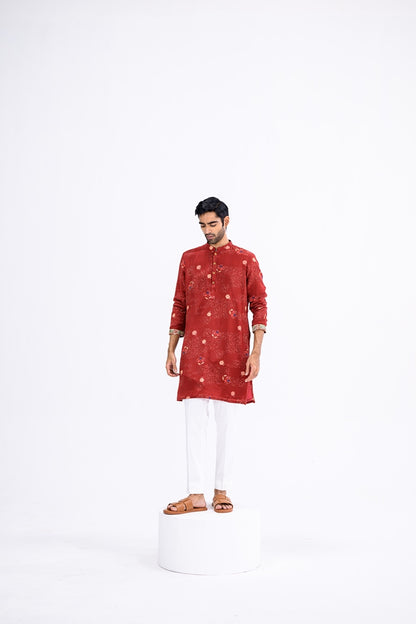 Red Overall Kurta Paired With White Pants And Highlight Sleeve Border