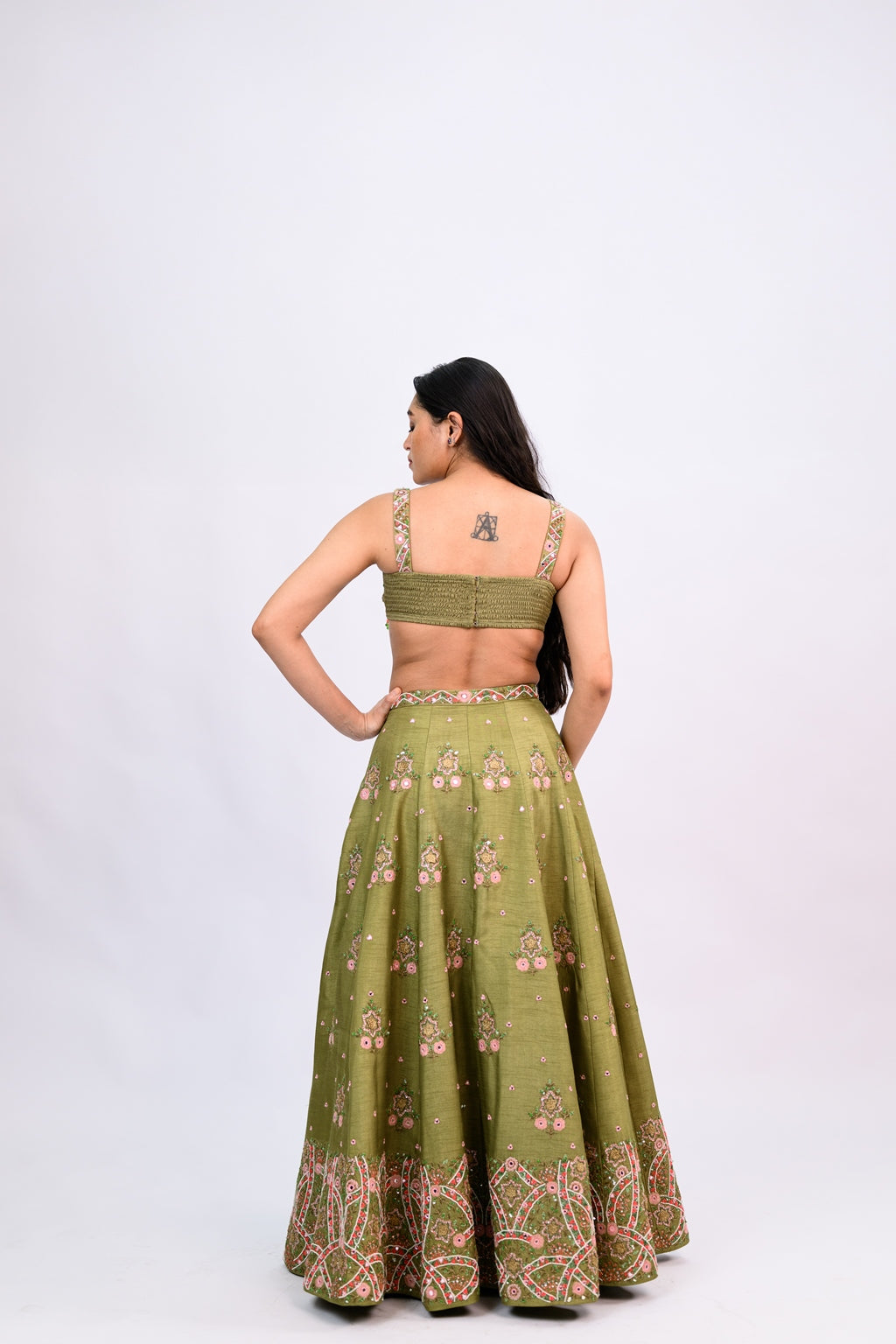 OLIVE GREEN BUTI LEHENGA PAIRED WITH EMBROIDERED BLOUSE WITH CUT WORK DUPATTA