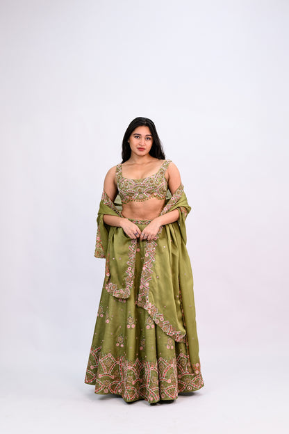 OLIVE GREEN BUTI LEHENGA PAIRED WITH EMBROIDERED BLOUSE WITH CUT WORK DUPATTA