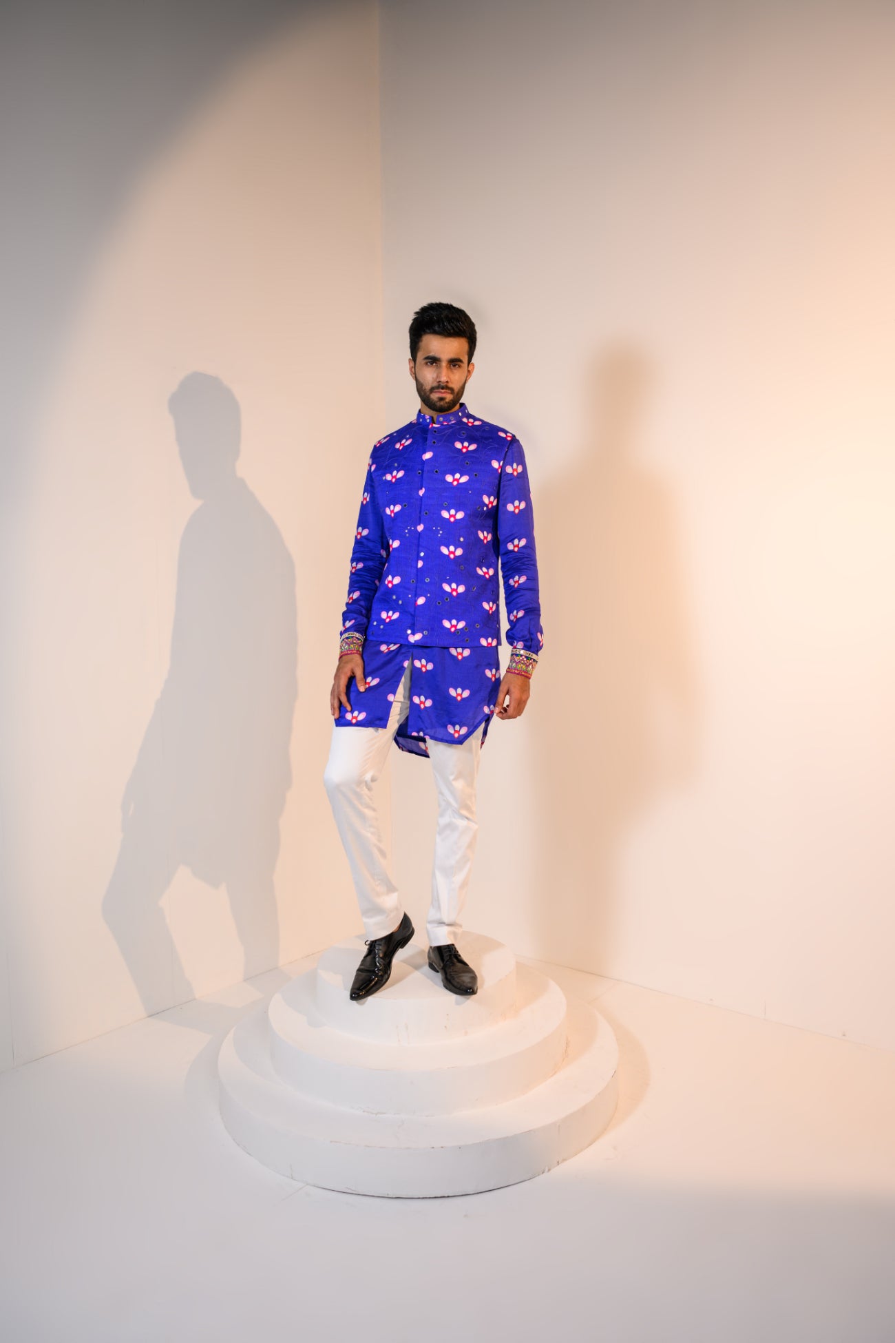 Our indica kurta paired with our indica bundi with self thread and mirror embriodery and white pants